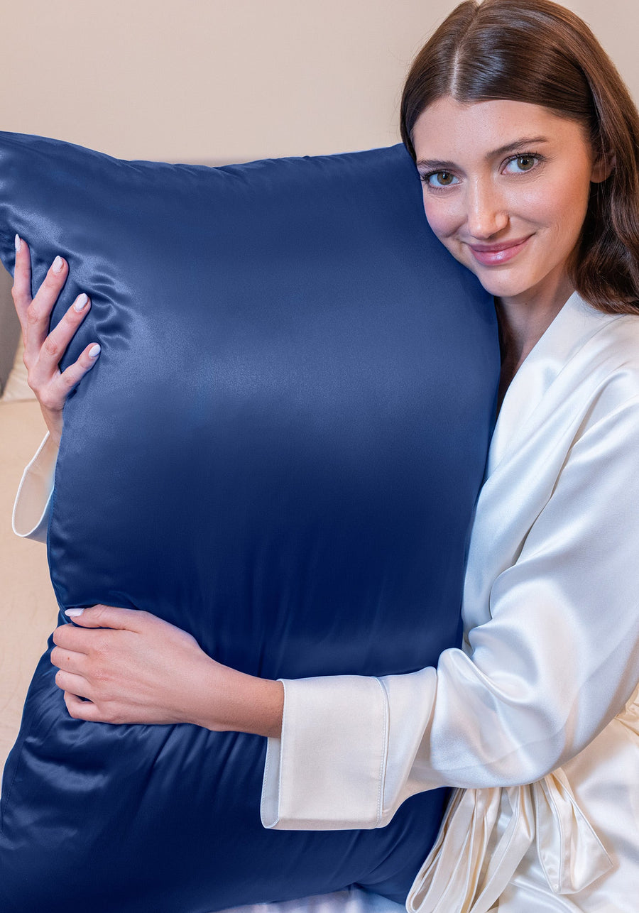 Woman sleeping peacefully on a pillow with blue Blissy mulberry silk pillowcase